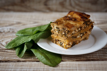 vegetarian lasagna with spinach serving on a plate