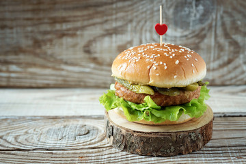 vegetarian Burger on a wooden background on a wooden stand