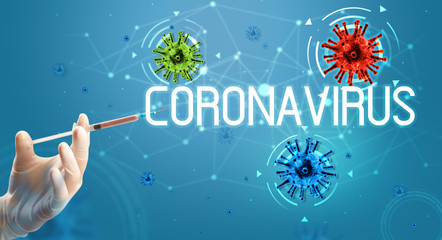 Syringe, medical injection in hand with CORONAVIRUS inscription, coronavirus vaccine concept