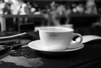 Steaming from hot white coffee  cup