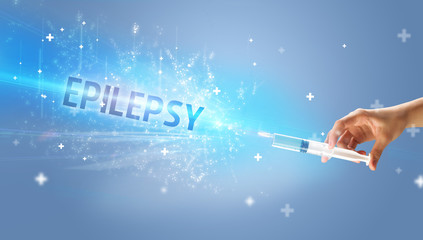 Syringe, medical injection in hand with EPILEPSY inscription, medical antidote concept