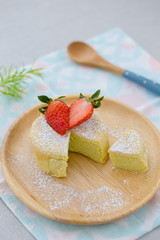 pandan sponge cake with strawberry and icing