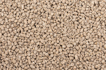 Granules of animal feed close up. Backgrounds  texture
