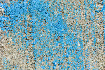 Old cracked weathered shabby blue painted plastered peeled wall banner background. Abstract concrete texture.