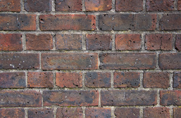 Texture of old erose brick wall damaged by fire