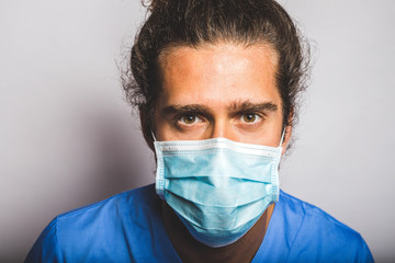 young adult wearing a medic mask and medic uniform