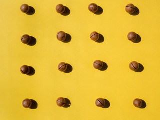 horizontal macadamia nuts pattern on yellow background