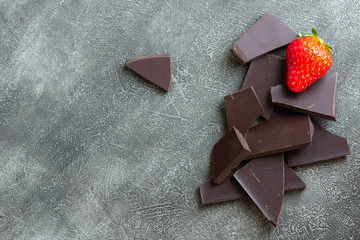 Chocolate with strawberry isolated on grey background. Copy space. 