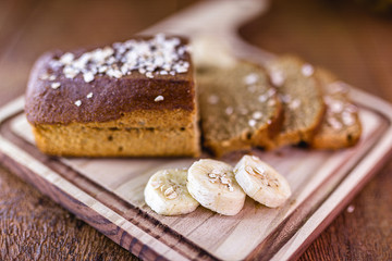 Fototapeta na wymiar homemade vegan bread with oats. Sliced ​​bread, banana flavor.