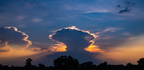Fototapeta na wymiar Amazing sunset, very colorful evening, strange cloud shape, eruption like a nuclear symbol.the best of sunset and sunrise.