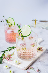 summer homemade juice with lime and blossom on stone table background