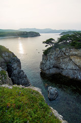 High cliffs in the ocean. Rocky islands and rocks in Orlik Bay in the Sea of Japan. Far East.