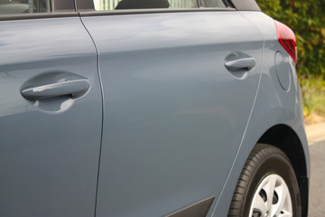 Side view of a grey car 