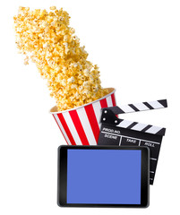 Flying popcorn, film clapper board and phone isolated on white background