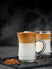 Two glass cups with Dalgona frothy coffee trend korean drink latte espresso with coffee foam