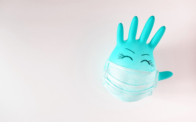  Blue medical latex gloves and face shield on a white background. Protective subjects. Remedies. Disposable rubber medical gloves and mask. 