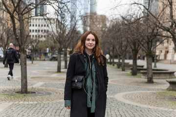 Young Woman Posing in City Pedestrian Zone