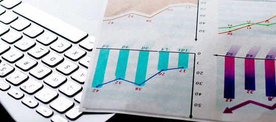 Estate planning. Calculator, glasses and black pen on financial documents