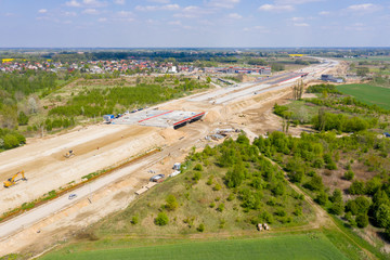 aerial top view on city construction site. construction of new highway at suburb area