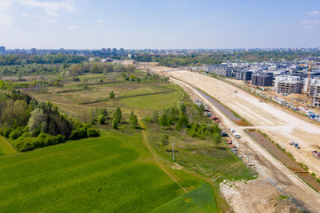 aerial top view on city construction site. construction of new highway at suburb area