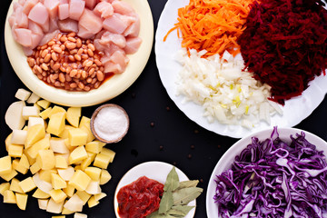 Step-by-step instructions for preparing a diet red borscht from chicken fillet. Step two - sliced and peeled raw ingredients, potatoes, beans, tomato paste, onions, cabbages, carrots, beetroot