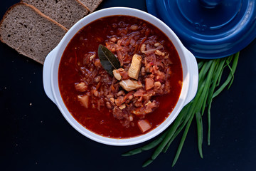 Step-by-step instructions for preparing a diet red borscht from chicken fillet. Step four - pour the finished dish into the dish, refill it with sour cream and serve it with bread.