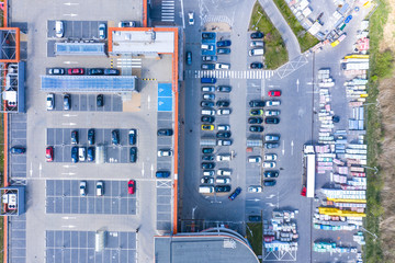 Big shopping mall of household goods with a lot of parking space, aerial view