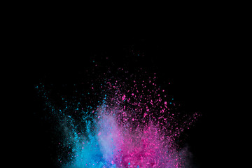 Explosion of colored powder isolated on black background. Abstract colored background