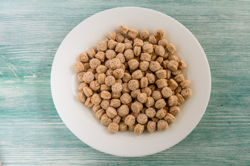 crispy bran in the white plate, healthy dieting snack