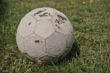 old ball on the grass