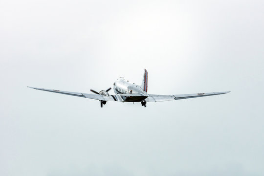 Douglas dakota DC3 old propeller passenger plane taking off from airport during airshow. Technology, aviation and transportation concept.