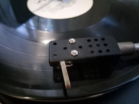 Vinyl player. The plate is on vinyl player.