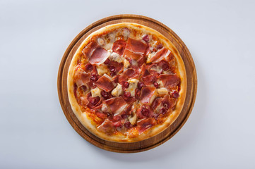 pizza lies on a white table. Pizza close up