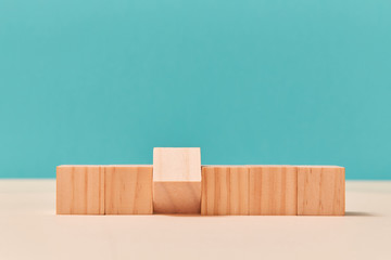Wooden cubes in flat line with one inverted brick. Mockup style. Design template for creative...