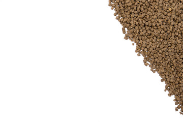 Granules of animal feed close up. Background texture isolated