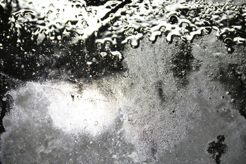 fondo abstracto gris y negro con manchas  y reflejos de luz 