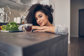 Beautiful young lady smiling at the camera