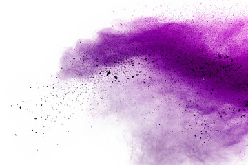 Explosion of colored powder on white background.Purple and pink dust splash.