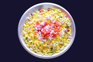 Indian tasty snacks Bhel served with chopped tomatoes,onions