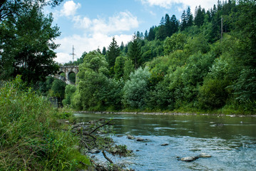 A piece of stone bridge in the Carpathians in summer