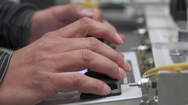 male hands use a joystick to control a modern device for 3D measurement