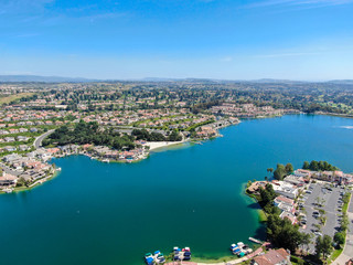 Fototapeta na wymiar Aerial view of Lake Mission Viejo, with recreational facilities, surrounded by private residential and condominium communities. Orange County, California, USA