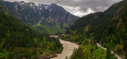 Fototapeta na wymiar Panoramic format photo of the fresh spring green foliage in the Lillooet-Fraser Canyon, British Columbia, Canada