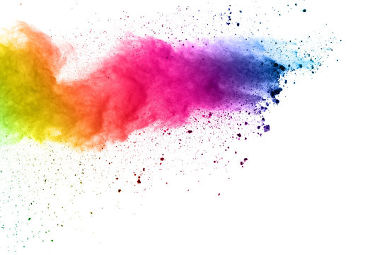 Colorful powder explosion on white background.Pastel color dust particle splashing.