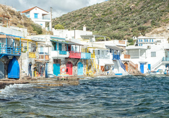 Fototapeta na wymiar Klima Fishing Village with bright coloured wooden doors - Milos Island - Greece