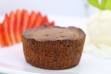  Chocolate dessert filled with hot chocolate cream on a plate with strawberries and cream ice cream