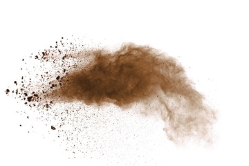 Fototapeta na wymiar Explosion of brown powder on black background.