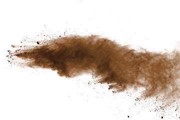 Fototapeta na wymiar Explosion of brown powder on black background.
