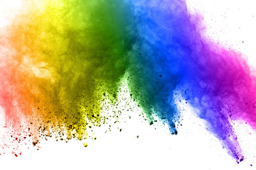Colorful powder explosion on white background.Pastel color dust particle splashing.