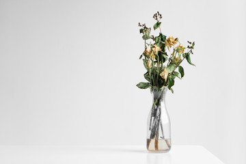Bouquet of wilted flowers on a white background